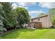 Spacious backyard with a pergola covered patio, a green lawn, and mature trees offering plenty of shade at 110 Avon Ln, Noblesville, IN 46062