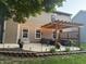 This backyard features a beautiful pergola with string lights, providing a warm and inviting outdoor space at 110 Avon Ln, Noblesville, IN 46062