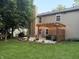 Cozy backyard patio featuring a pergola with string lights, perfect for outdoor relaxation and entertaining at 110 Avon Ln, Noblesville, IN 46062