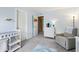 This Bedroom features light blue walls, a rocker, a white dresser, and a changing table at 110 Avon Ln, Noblesville, IN 46062