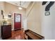 Inviting foyer with a red front door, wooden floors, and coat storage, creating a warm welcome at 110 Avon Ln, Noblesville, IN 46062