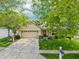 Charming single-story home with a well-manicured lawn, mature trees, and an attached two car garage at 110 Avon Ln, Noblesville, IN 46062