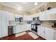 Modern kitchen with white cabinets, stainless steel appliances, and open layout at 110 Avon Ln, Noblesville, IN 46062