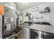 Functional laundry room with modern washer, dryer, shelves, and ample storage space at 110 Avon Ln, Noblesville, IN 46062