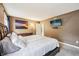 This main bedroom features a queen bed, neutral walls and carpets, and access to an en suite bathroom at 110 Avon Ln, Noblesville, IN 46062