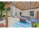 Inviting outdoor patio with a pergola, stylish seating, and lush greenery surrounding the space at 110 Avon Ln, Noblesville, IN 46062