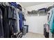 An organized walk-in closet has hanging clothes and shelving with organizing baskets at 110 Avon Ln, Noblesville, IN 46062