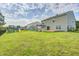 Expansive backyard featuring a deck, playground, and ample green space for outdoor activities at 1287 Highland Lake Way, Brownsburg, IN 46112
