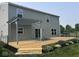Backyard with a wooden deck, black fence, and garden, offering a serene outdoor retreat at 1287 Highland Lake Way, Brownsburg, IN 46112