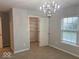 Bright bedroom with a chandelier, window, and closet provides a stylish and organized space at 1287 Highland Lake Way, Brownsburg, IN 46112