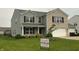 Charming two-story home with a combination of vinyl siding and brick facade, complemented by well-maintained landscaping at 1287 Highland Lake Way, Brownsburg, IN 46112