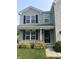 Inviting front porch with decorative plants and stylish number display at 1287 Highland Lake Way, Brownsburg, IN 46112