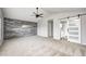 Bright main bedroom with a feature wall and barn door leading to ensuite bathroom at 1287 Highland Lake Way, Brownsburg, IN 46112