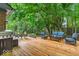 Inviting backyard deck area featuring comfortable seating and a grill, perfect for outdoor gatherings at 12961 Limberlost Dr, Carmel, IN 46033