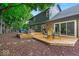 Multi-tiered deck with outdoor seating and dining area offers a relaxing backyard space at 12961 Limberlost Dr, Carmel, IN 46033