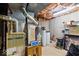 A utility room in the unfinished basement provides mechanicals and other systems at 12961 Limberlost Dr, Carmel, IN 46033