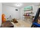 Unfinished basement with painted walls, storage shelving, and a small window provides potential at 12961 Limberlost Dr, Carmel, IN 46033