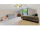 Cozy bedroom featuring a ceiling fan and a large window with plenty of natural light at 12961 Limberlost Dr, Carmel, IN 46033
