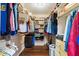 Well-organized walk-in closet with ample hanging and storage space for clothing and accessories at 12961 Limberlost Dr, Carmel, IN 46033