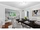 A formal dining room is open to the adjacent living room at 12961 Limberlost Dr, Carmel, IN 46033