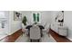 Elegant dining room with seating for six, hardwood floors, and decorative accents at 12961 Limberlost Dr, Carmel, IN 46033