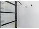 Modern shower features glass doors, white subway tile, and sleek black hardware at 12961 Limberlost Dr, Carmel, IN 46033