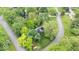 Aerial shot features a home with a well-manicured lawn, mature trees, and neighborhood streets at 13297 Highland Springs Dr, McCordsville, IN 46055
