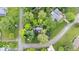 An aerial view showcases a home with mature landscaping and proximity to community streets at 13297 Highland Springs Dr, McCordsville, IN 46055