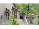 Inviting back deck featuring outdoor seating and a grill, surrounded by lush greenery at 13297 Highland Springs Dr, McCordsville, IN 46055