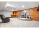 Basement with wood-burning stove, custom brick hearth, bar area and wood paneling at 13297 Highland Springs Dr, McCordsville, IN 46055