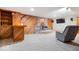 Finished basement with wood-burning stove, custom brick hearth, bar, and entertainment area at 13297 Highland Springs Dr, McCordsville, IN 46055