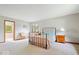 Bright bedroom with a wrought iron bed frame and a decorative wooden bench near the entry at 13297 Highland Springs Dr, McCordsville, IN 46055