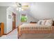 Cozy bedroom featuring a pitched ceiling, ceiling fan, and a window letting in natural light at 13297 Highland Springs Dr, McCordsville, IN 46055
