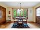 Breakfast nook featuring hardwood floors, a window view, and a charming table setting at 13297 Highland Springs Dr, McCordsville, IN 46055