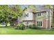 Attractive exterior with brick accents, neutral siding, a small fenced area, and lush landscaping at 13297 Highland Springs Dr, McCordsville, IN 46055