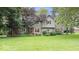 Charming two-story home boasts a well-manicured lawn, brick accents, and neutral siding for a welcoming curb appeal at 13297 Highland Springs Dr, McCordsville, IN 46055