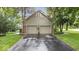 Attached garage with double doors and brick accents at 13297 Highland Springs Dr, McCordsville, IN 46055