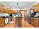 Bright kitchen featuring wood cabinets, stainless steel appliances, and center island at 13297 Highland Springs Dr, McCordsville, IN 46055