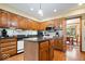 Well-lit kitchen featuring wooden cabinets, modern appliances, and island at 13297 Highland Springs Dr, McCordsville, IN 46055