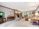 Spacious living room featuring a brick fireplace and traditional furnishings at 13297 Highland Springs Dr, McCordsville, IN 46055