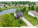 Aerial view showcasing the home's landscaping and proximity to a scenic pond in the neighborhood at 1408 Snead Cir, Avon, IN 46123