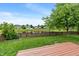 Peaceful backyard view includes a tranquil pond and manicured lawn with a deck perfect for relaxation at 1408 Snead Cir, Avon, IN 46123