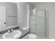 Cozy bathroom featuring a sink vanity with neutral tiled floors and a glass-door standing shower at 1408 Snead Cir, Avon, IN 46123