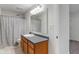 Bright bathroom with a large mirror, updated fixtures, and shower curtain at 1408 Snead Cir, Avon, IN 46123