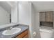Cozy bathroom with gray countertop, storage cabinet, modern toilet and neutral walls at 1408 Snead Cir, Avon, IN 46123