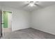Neutrally painted bedroom featuring plush carpeting, ceiling fan and a view of a beautifully painted room at 1408 Snead Cir, Avon, IN 46123