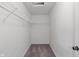 Spacious walk-in closet with ample shelving and neutral carpeting perfect for organized storage at 1408 Snead Cir, Avon, IN 46123