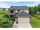 Two-story home with brick and vinyl siding, complemented by a well-manicured lawn and an attached two-car garage at 1408 Snead Cir, Avon, IN 46123