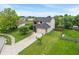 Two-story home with a manicured lawn, long driveway, and beautiful landscaping at 1408 Snead Cir, Avon, IN 46123