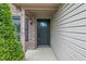A welcoming front entrance with a black door, brick accents, and a well-maintained trim at 1408 Snead Cir, Avon, IN 46123
